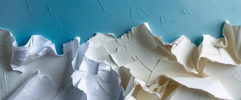 A close up of a mountain range with torn paper photo