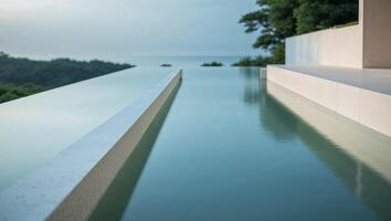 A long pool with a view of the ocean photo