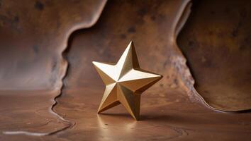 A golden star with sharp edges on a textured brown background photo