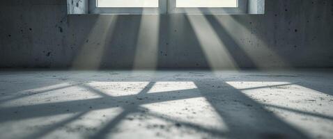 Sunlight shining through a window illuminating a concrete surface. photo