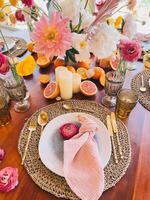 Elegant Table Setting with Flowers and Fresh Fruits photo