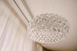 An Elegant Hanging Chandelier Adorned with Clear Glass Beads photo