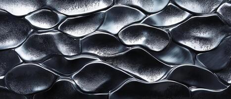 Hammered aluminum displays a unique textured surface with irregular, flowing patterns and shine. photo