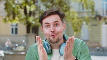 Amazed man looking surprised at camera with big open eyes, shocked by sudden victory good news video