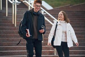 Having, a break. Two young students are together outdoors photo
