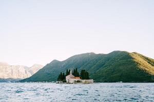 Island of St. George in the Bay of Kotor with mountains in the background. Montenegro photo