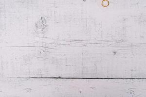White wooden background with scratches and rust spots photo
