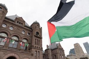 Toronto, Canada - 18 October 2023. he streets of Toronto pulse with solidarity, as diverse crowds gather to voice their support for Palestinian rights. photo