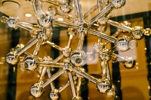 Modern Chandelier Design with Metallic Spheres and Rods photo
