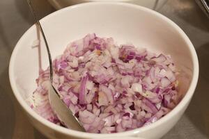 bowl of chopped red onion photo