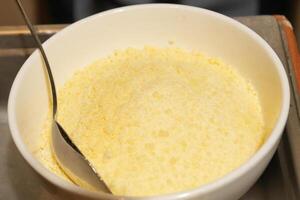 bowl of parmesan or salty cheese photo