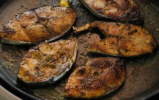 grilled fish in a hot plate photo