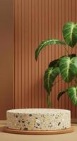 Natural product display with a speckled platform, warm brown backdrop, and tropical leaves photo