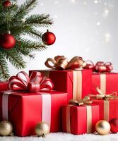 Red gift boxes adorned with gold and red ribbons are arranged on a snowy surface with sparkling bokeh lights in the background photo