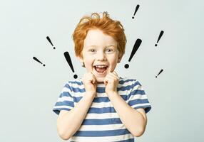 Joyful child with exclamation graphics - expressive portrait for children's design photo