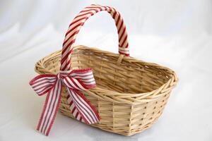 A Small Wicker Basket with a Red Apple Inside Photo