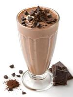 A tall, clear glass filled with a rich, smooth chocolate milkshake photo