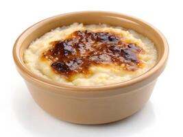 Delicious Rice Caramel Pudding in a Glass Jar on a Rustic Table photo