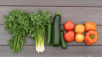 A group of vegetables on a wooden table photo