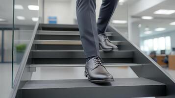 A man in a suit and tie walking up a set of stairs photo