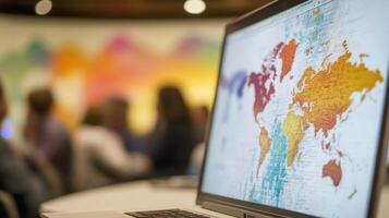 A closeup of a laptop screen showing data analytics related to global challenges with the blurred image of participants in the background engaged in conversation framed by the colorfu photo