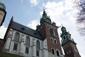 Historic Cathedral Building with Towers in Krakow, Poland, Under Clear Sky photo
