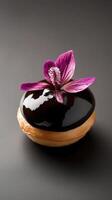 Gourmet profiterole showcasing vanilla-bean cream and tropical guava ganache with a crystallized hibiscus petal photo