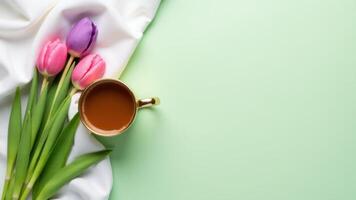 Tulips With Coffee Cup On Fabric photo