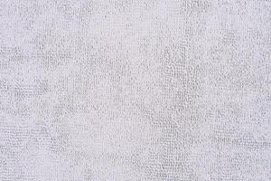 Grey microfiber cloth with intricate textured loop weave that creates a soft fabric texture, ideal for wiping away dust and dirt when cleaning your home, photo