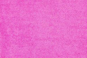 Fuchsia microfiber cloth with intricate textured loop weave that creates a soft fabric texture, ideal for wiping away dust and dirt when cleaning your home, photo