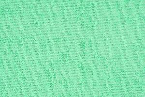 Textured surface microfiber cloth with complex loop pattern, ideal for wiping dust and dirt during delicate cleaning of the house, soft mint color photo