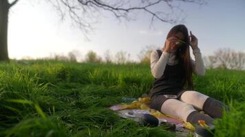 A Young Woman Experiencing and Enjoying a Creative Moment While Surrounded by Nature video