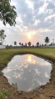 Tranquil Sunset Reflection in a Puddle photo