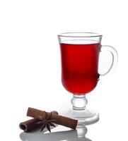 Mulled wine with spices on a white background photo