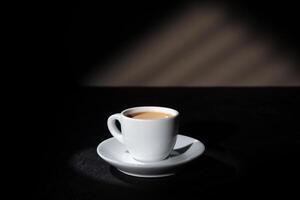 Cup of espresso on dark background photo