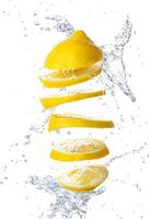 Sliced lemon with water on a white isolated background photo