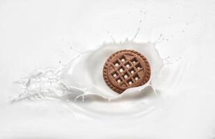 Cookies in milk with a splash photo