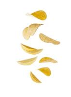 Falling potato chips isolated on white background. photo
