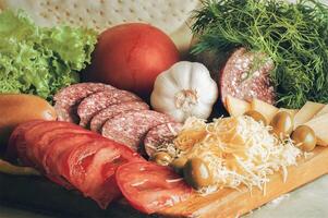 A wooden cutting board with various types of food photo