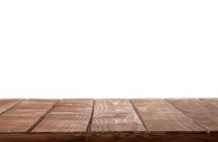Wooden table top on isolated white background photo