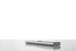 Modern metal remote control from tv on a white background photo