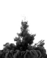 Black ink in water on a white background photo