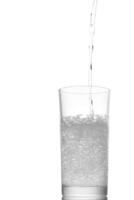 A glass of water with a splash of liquid photo