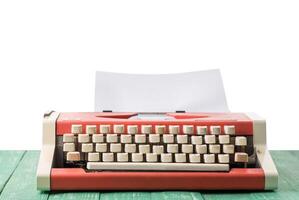 A typewriter on a table with an isolated background photo