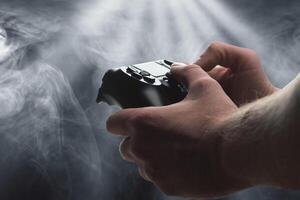 Hands with a gamepad - gaming concept photo