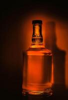 Whiskey bottle on dark background photo