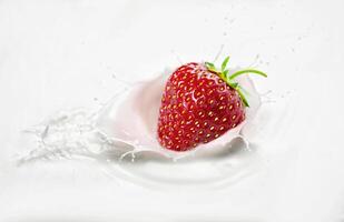 Strawberries in milk with splashes photo