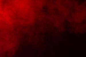 red smoke on black background photo