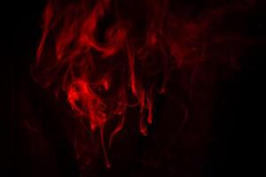 Texture of red smoke on black background photo