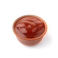 Gravy boat with ketchup on isolated background photo